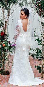 The same bride showing the V-shaped back design (scaled)