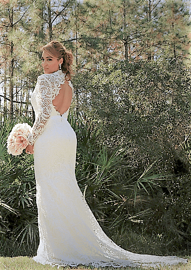 The same bride showing the mermaid tail of the dress and its backless design (scaled)