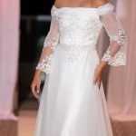 An off-shoulder wedding dress with net long sleeves