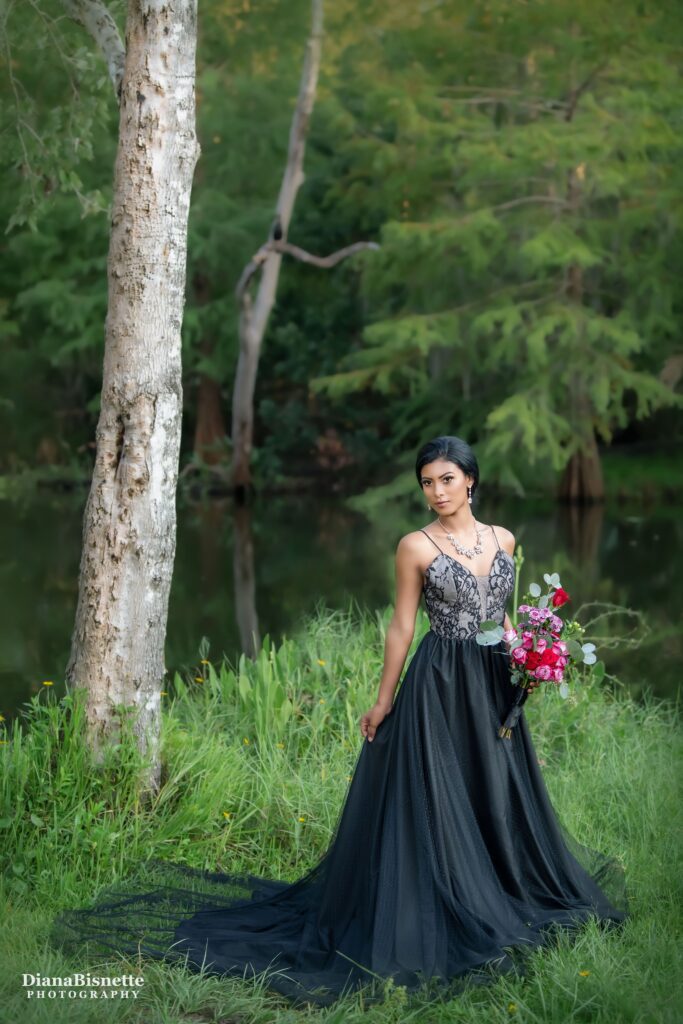 Bride waring a beautiful black wedding dress at the Orlando Botanical Garden