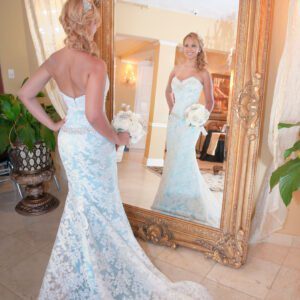 A bride looking at herself on a mirror