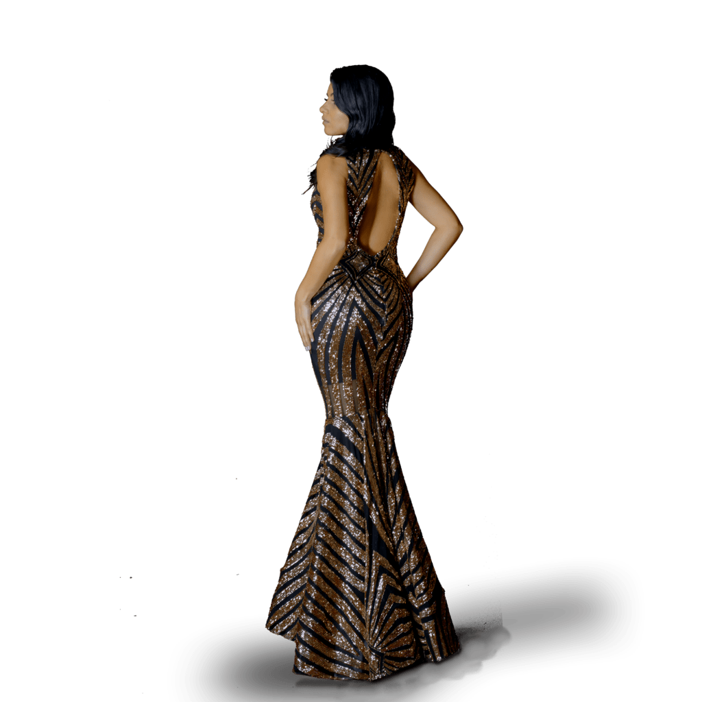 Woman wearing a custom made prom dress, elegant black and rose gold mermaid fitted open back prom elegant floor length with a long full train, 