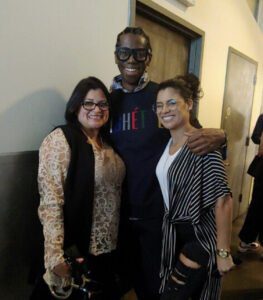 A Black man and two women, all wearing glasses