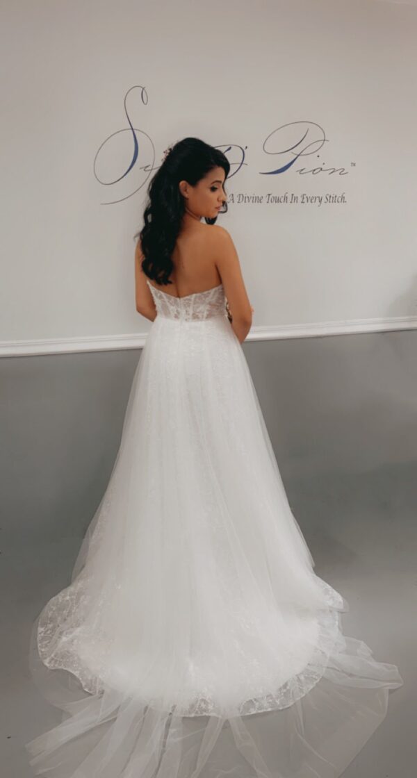 The back view of a bride in a bridal gown.