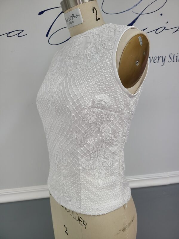 A mannequin with a Bridal lace Top, Wedding Separate on it.