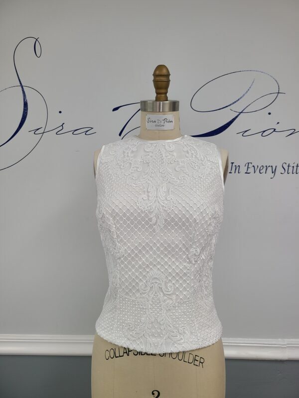 A white mannequin with a Bridal lace Top, Wedding Separate.