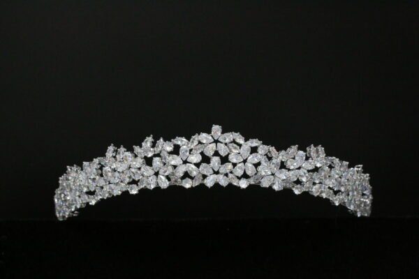 A white tiara with diamonds on it.