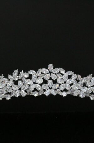 A white tiara with diamonds on it.