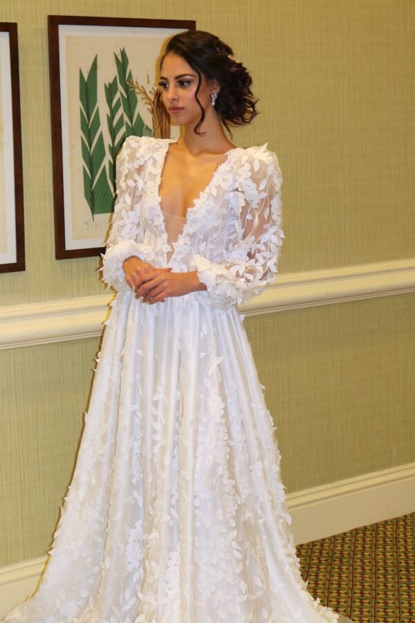 A Wedding Dress Designer creates made to order wedding dresses at a wedding dress shop in Orlando.