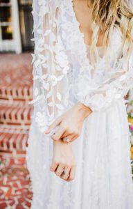 Plunge A-line wedding dress, botanical, floral design, long sleeve wedding gown, deep v-neckline.